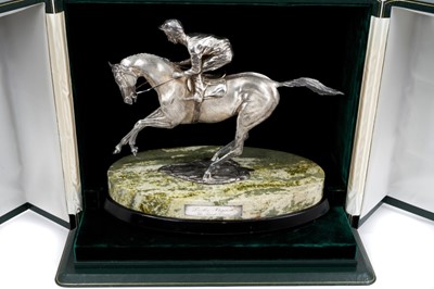 Lot 901 - A fine and impressive silver sculpture, 'The Final Frame', Lester Piggott on horseback, raised upon an oval green variegated marble base and oval wooden plinth, hallmarked London 1986