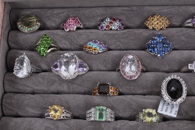 Lot 822 - Collection of 43 silver gem set dress rings displayed in a ring tray