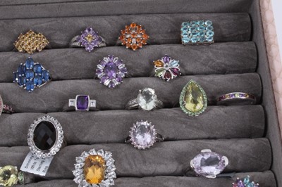 Lot 822 - Collection of 43 silver gem set dress rings displayed in a ring tray