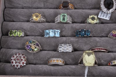 Lot 822 - Collection of 43 silver gem set dress rings displayed in a ring tray