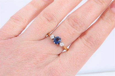 Lot 839 - 18ct gold sapphire and diamond three stone ring