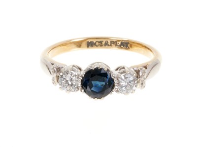 Lot 432 - Sapphire and diamond three stone ring in platinum setting on 18ct yellow gold shank