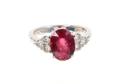 Lot 428 - Pink tourmaline and diamond ring with an oval mixed cut pink tourmaline weighing approximately 3.29cts flanked by six brilliant cut diamonds in claw setting on 18ct white gold shank. Estimated tota...