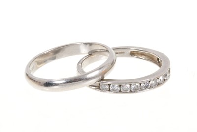 Lot 472 - Diamond and platinum eternity ring with a half hoop of twelve brilliant cut diamonds in channel setting, estimated total diamond weight approximately 0.50cts, together with a platinum wedding ring...