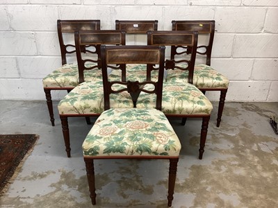 Lot 1303 - A composite set of ten Regency mahogany dining chairs with rail backs and shaped or spiral bars, upholstered seats on ring turned legs and reeded sabre legs