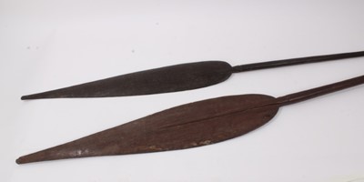 Lot 834 - Two antique tribal paddle clubs