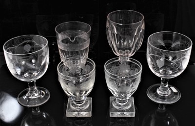 Lot 25 - A group of six 19th century glasses, including a pair of large goblets engraved with hops and barley, a pair of rummers on square bases engraved with grapevines, an unusual glass with spout, and an...