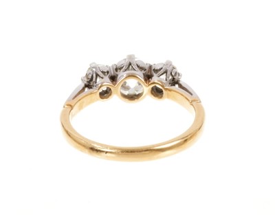 Lot 427 - Diamond three stone ring with three old cut cushion shape diamonds in platinum claw setting on 18ct gold shank. Estimated total diamond weight approximately 1.68cts
