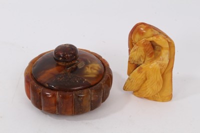 Lot 776 - Amber pot and cover together with an Amber carving
