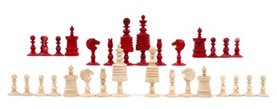 Lot 729 - 19th century carved and red stained bone chess set, the king 9cm high, in wooden case