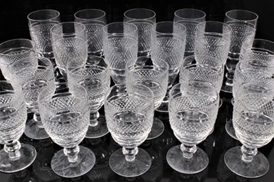 Lot 81 - Service of 21 Waterford Cashel pattern wine glasses, including twelve white wine glasses measuring 12cm high, and nine champagne flutes measuring 12.25cm high