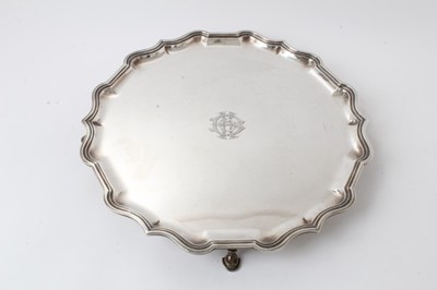 Lot 215 - Large Georgian style silver salver with piecrust edge on four hoof feet