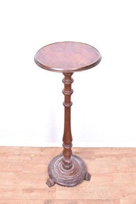 Lot 1310 - 19th century walnut torchère stand, on circular base and scroll feet, 97cm high