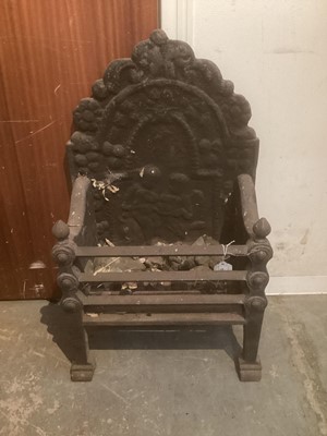 Lot 1315 - 17th century style cast iron fire basket, with arched decorative fireback and square basket raised on tapered supports, 37cm wide