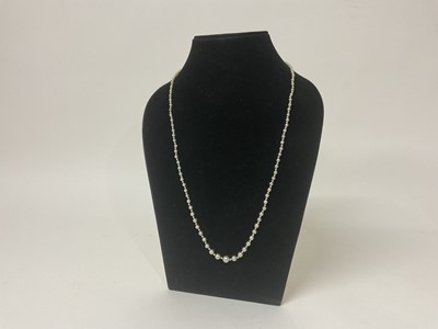 Lot 495 - Natural pearl necklace with a string of 201 graduated natural saltwalter pearls, the largest 6.6mm in width, the smallest 1.7mm in width, on a rose cut diamond barrel clasp. Accompanied by a Pearl...
