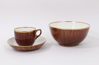 Lot 718 - A Rockingham tortoiseshell glazed teacup, saucer and a bowl, circa 1840
