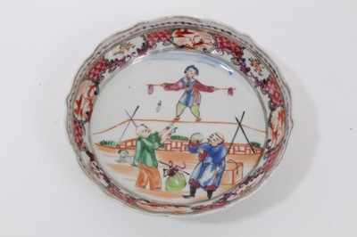 Lot 89 - A Chinese famille rose saucer, painted with acrobats, Qianlong