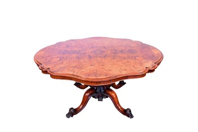 Lot 1337 - Good quality Victorian figured walnut breakfast table, with shaped quarter veneered top hinging on carved quatrefoil pierced column and splayed cabriole legs on castors