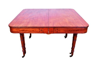 Lot 1338 - Good mahogany extending dining table, the rounded rectangular top with geometric deep frieze raised on ring turned legs and brass capping and castors, with three additional leaves, 130 x 120cm exte...