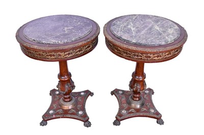 Lot 1350 - Pair of continental empire style marble topped circular side tables, drum tops with gilt metal foliate mounts, on vase shaped column and plaque mounted platform base, on paw feet, 52cm wide