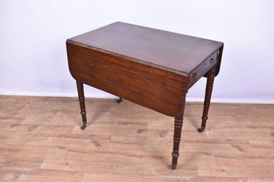 Lot 1363 - Regency mahogany pembroke table, with rounded rectangular drop leaf top on ring tuned legs and castors, 87cm wide