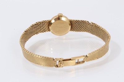 Lot 612 - 18ct gold Longines wristwatch with mechanical movement in circular gold case on integral gold Milanese bracelet, case 16mm diameter.