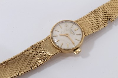 Lot 612 - 18ct gold Longines wristwatch with mechanical movement in circular gold case on integral gold Milanese bracelet, case 16mm diameter.