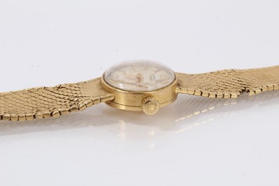 Lot 612 - 18ct gold Longines wristwatch with mechanical movement in circular gold case on integral gold Milanese bracelet, case 16mm diameter.