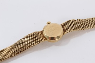 Lot 612 - 18ct gold Longines wristwatch with mechanical movement in circular gold case on integral gold Milanese bracelet, case 16mm diameter.