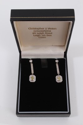Lot 460 - Pair of yellow diamond and white diamond pendant earrings, each with a rectangular cushion cut yellow diamond measuring approximately 4.3mm x 3.6mm x 2.4mm surrounded by brilliant cut diamonds susp...