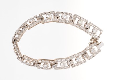 Lot 418 - Art Deco style diamond bracelet articulated rectangular openwork panels, each with a round brilliant cut diamond within a diamond border, in white gold setting. Estimated total diamond weight appro...