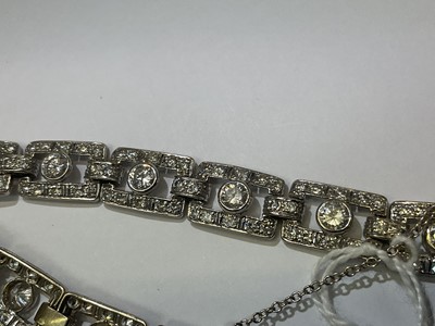 Lot 418 - Art Deco style diamond bracelet articulated rectangular openwork panels, each with a round brilliant cut diamond within a diamond border, in white gold setting. Estimated total diamond weight appro...