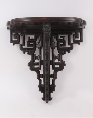 Lot 849 - Late 19th/early 20th Chinese carved hardwood wall bracket, with geometric pierced supports, 34cm wide
