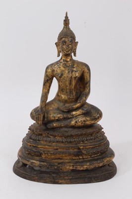 Lot 852 - Tibetan gilded bronze Buddha figure, depicted in serene pose raised on stepped lappet base, 30cm high
