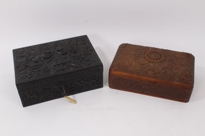 Lot 856 - Antique Ceylonese relief carved ebony and bone inlaid box, together with Indian carved cushion form casket. (2)