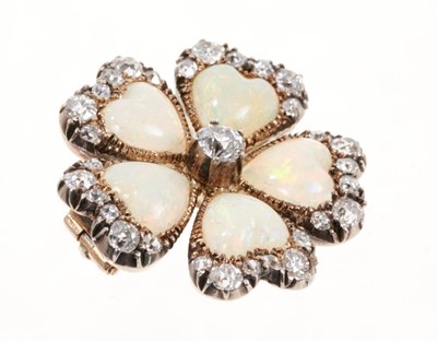Lot 476 - Late Victorian opal and diamond flower brooch in the form of a pansy, with five heart shaped opal petals and old cut diamonds in silver and gold setting, 24mm.