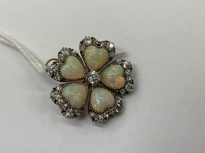 Lot 476 - Late Victorian opal and diamond flower brooch in the form of a pansy, with five heart shaped opal petals and old cut diamonds in silver and gold setting, 24mm.