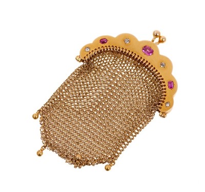 Lot 481 - Late 19th century French gold ruby and diamond purse with three oval mixed cut rubies and four rose cut diamonds and gold chain mail links, French eagle's head control marks, 90mm.