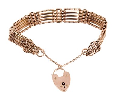 Lot 482 - Antique 9ct rose gold gate bracelet with five bar gate links padlock clasp, approximately 18cm.