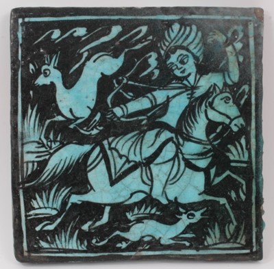 Lot 124 - Large Islamic turquoise tin glazed pottery tile with an equestrian scene, 24.5cm x 25cm