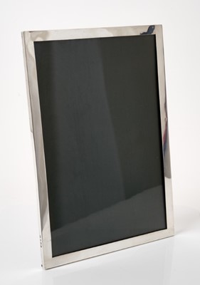 Lot 321 - Large George V silver photograph frame of rectangular form with oak backing and easel support, (Birmingham 1915), maker Deakin & Francis, 28 x 19cm
