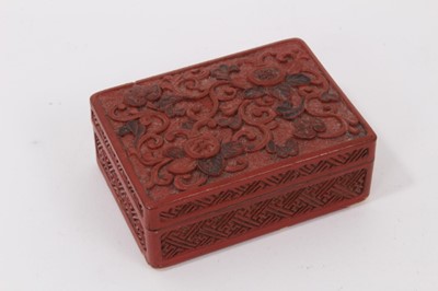 Lot 798 - Chinese cinnabar lacquer box of rectangular form with floral decoration, 7.5cm in length.