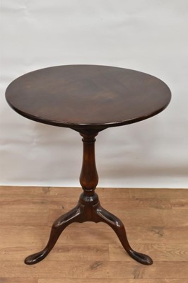 Lot 1501 - George II red walnut occasional table, with solid circular tilt-top on bird-cage action and vase shaped column of tripod cabriole legs, 54cm diameter