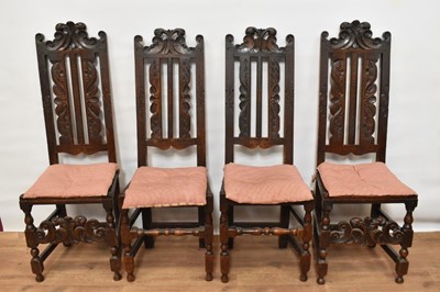 Lot 1392 - Set of four 17th century carved oak high dining chairs, each with pierced top rails and vertical splats, solid seat on turned and block under structure