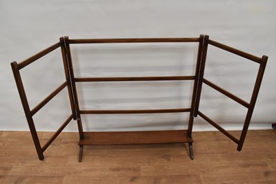 Lot 1494 - Regency mahogany towel rail, with platform base on spread feet, 92cm wide