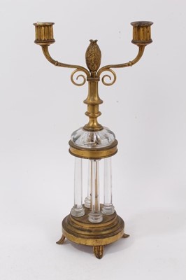 Lot 686 - 19th century Continental ormolu and cut glass candlestick, with twin arms issuing from knopped column with bud finial, on glass colonnade supports, spread feet, 37cm high