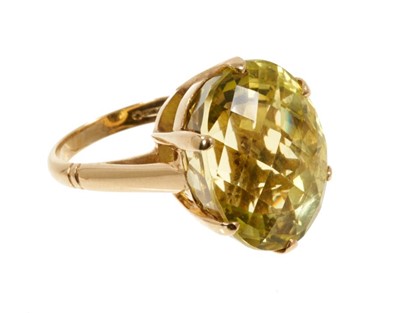 Lot 564 - Lemon quartz cocktail ring with a large oval fancy mixed cut lemon quartz in 18ct yellow gold setting