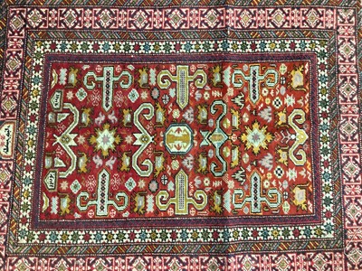 Lot 1508 - Small tribal rug, with angular ornament on brick red ground, 80 x 67cm, together with three other various rugs