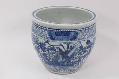 Lot 135 - 19th century Chinese blue and white porcelain jardinière, decorated with birds and flowers, the bottom with a border of stylised waves, the top with a border of flowers on a diaper ground, 25.5cm h...