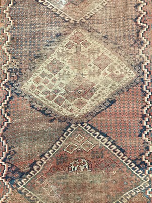 Lot 1512 - Persian rug, with four serrated conjoined medallions in multiple geometric borders, 260 x 153cm, together with a small rug. (2)